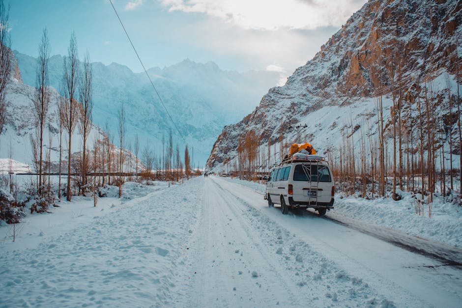Explore the winter beauty of Hunza Nagar's snow-covered roads and majestic mountains.