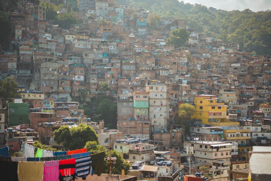 Vivid hillside houses in a densely packed Rio de Janeiro neighborhood, illustrating vibran